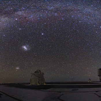 A total eclipse of the Moon is an impressive spectacle. But it also provides another viewing opportunity: a dark, moonlight-free starry sky. At Cerro Paranal in the Chilean Atacama Desert, one of the most remote places in the world, the distance from sources of light pollution makes the night sky all the more remarkable during a total lunar eclipse. This panorama photo, taken by ESO Photo Ambassador Yuri Beletsky, shows the view of the starry sky from the site of ESO’s Very Large Telescope (VLT) at Cerro Paranal during the total lunar eclipse of 21 December 2010. The reddish disc of the Moon is seen on the right of the image, while the Milky Way arches across the heavens in all its beauty. Another faint glow of light is also visible, surrounding the brilliant planet Venus in the bottom left corner of the picture. This phenomenon, known as zodiacal light, is produced by sunlight reflecting off dust in the plane of the planets. It is so faint that it’s normally obscured by moonlight or light pollution. During a total lunar eclipse, the Earth’s shadow blocks direct sunlight from the Moon. The Moon is still visible, red in colour because only light rays at the red end of the spectrum are able to reach the Moon after being redirected through the Earth’s atmosphere (the blue and green light rays are scattered much more strongly). Interestingly the Moon, which appears above one of VLT’s Unit Telescopes (UT2), was being observed by UT1 that night. UT1 and UT2 are also known as Antu (meaning The Sun in Mapudungun, one of Chile’s native languages) and Kueyen (The Moon), respectively. Links  ESO Photo Ambassadors webpage  #L